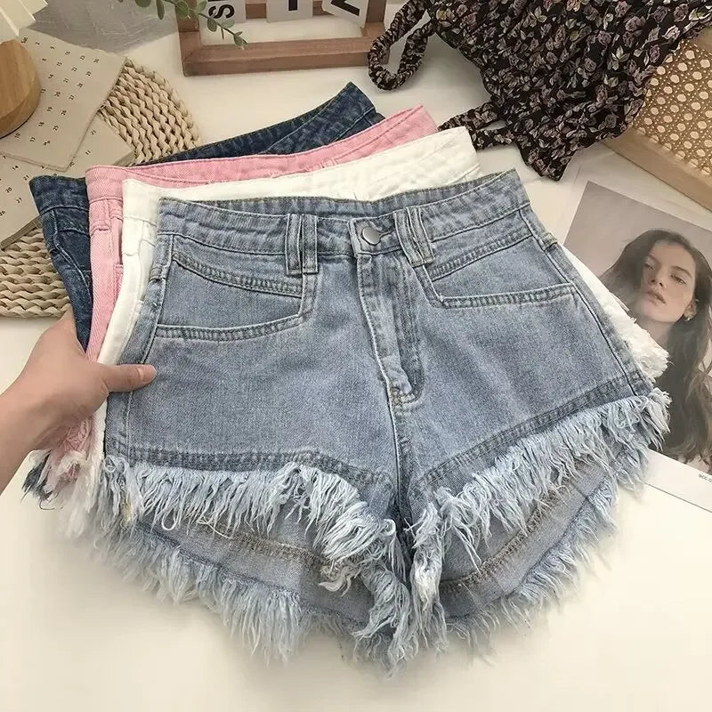 Shorts de mezclilla de cintura alta con flecos