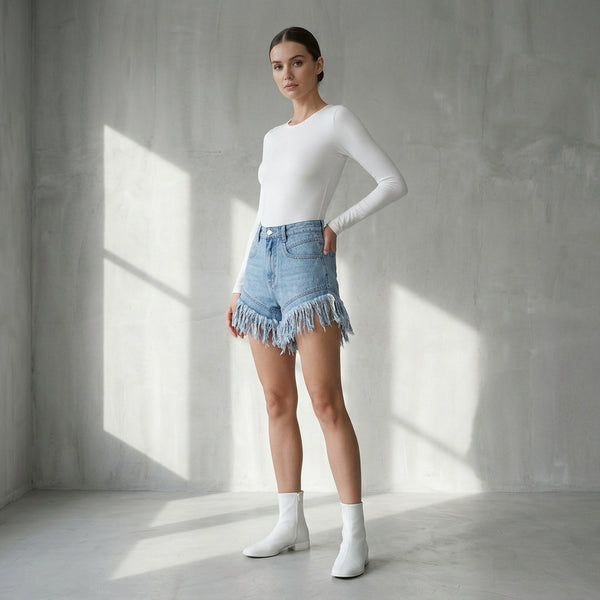 Shorts de mezclilla de cintura alta con flecos